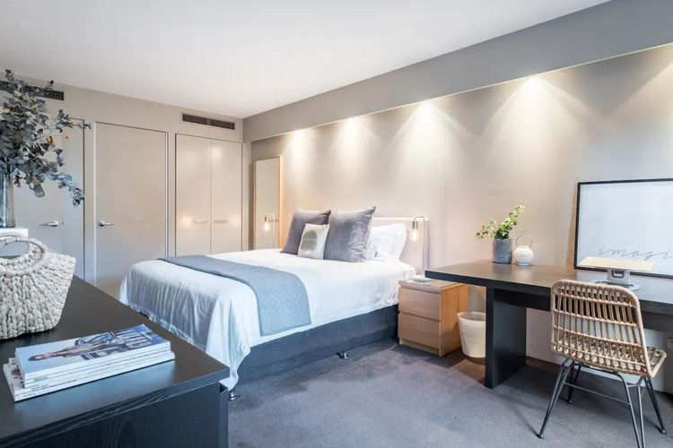 Serenity meets productivity in our stylish bedroom with a dedicated workspace.