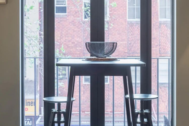 Step into elegance with French doors opening to city views.