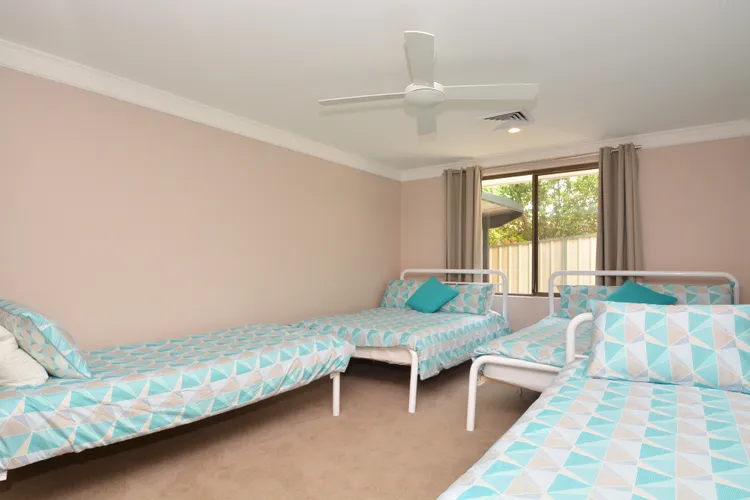 Bedroom with 1 queen bed, 1 double and 2 singles