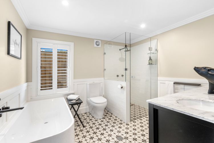 Luxe bathroom with shower and bathtub