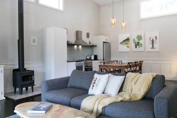 Luxe lounge, dining and kitchen area with fireplace