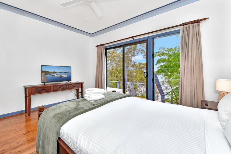Bedroom 1 with Tv, balcony and Waterview