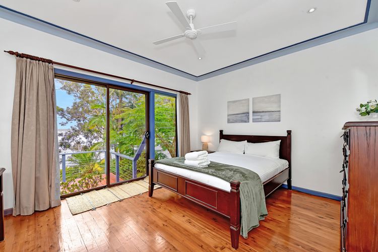 Bedroom 1 with a double bed and water view balcony