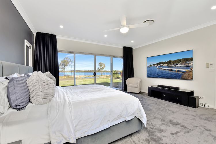 Lake Palm Resort Luxury Retreat absolute Waterfront on 3 acres at Lake Macquarie.