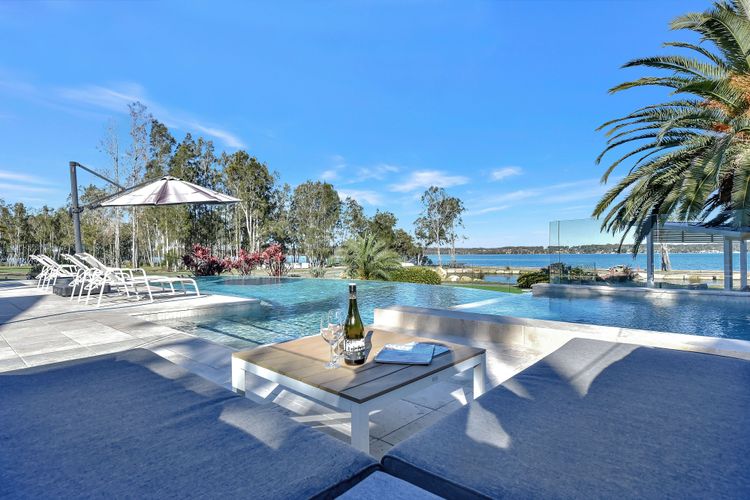 Lake Palm Resort Luxury Retreat absolute Waterfront on 3 acres at Lake Macquarie.