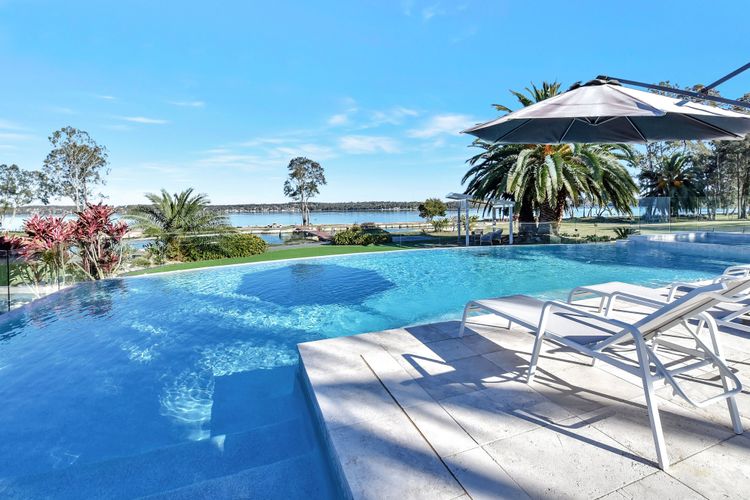 Lake Palm Resort Luxury Retreat absolute Waterfront on 3 acres at Lake Macquarie.