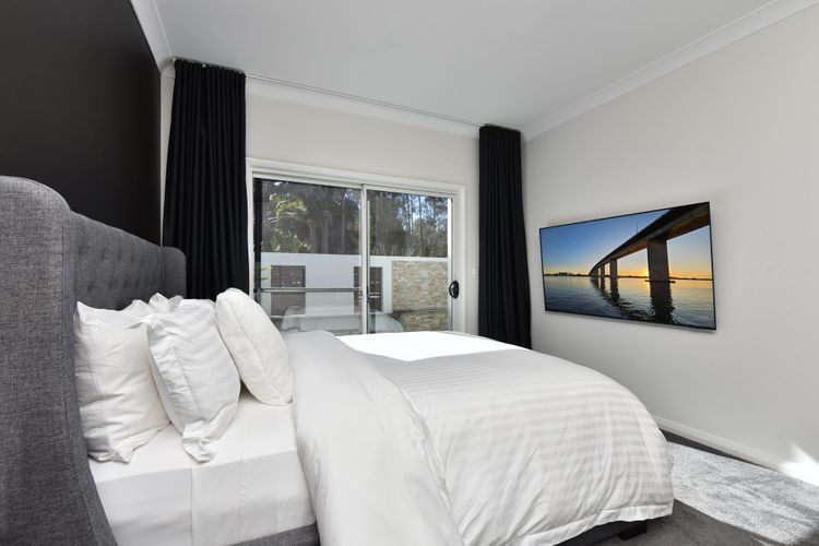 Lake Palm Resort Luxury Retreat absolute Waterfront on 3 acres at Lake Macquarie.