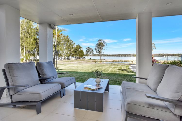 Lake Palm Resort Luxury Retreat absolute Waterfront on 3 acres at Lake Macquarie.