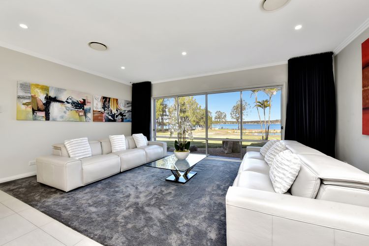 Lake Palm Resort Luxury Retreat absolute Waterfront on 3 acres at Lake Macquarie.