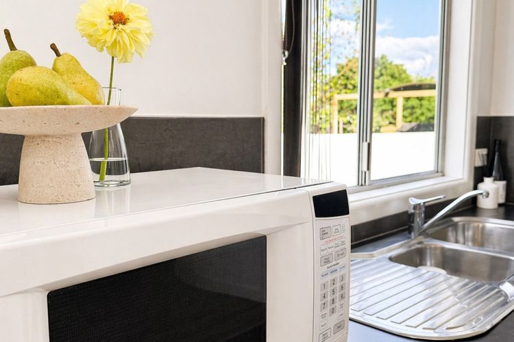 A practical kitchenette equipped with a microwave