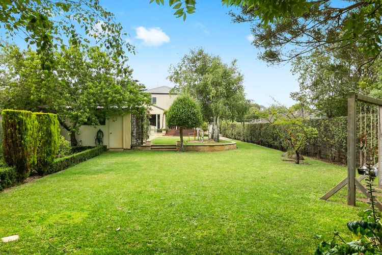 Expansive garden oasis with swings