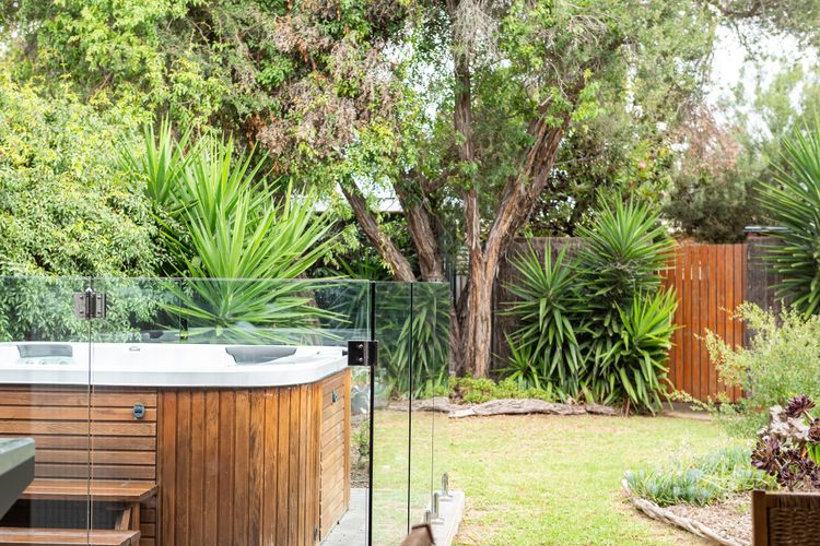 Enjoy the spa while the kids play in the secure yard