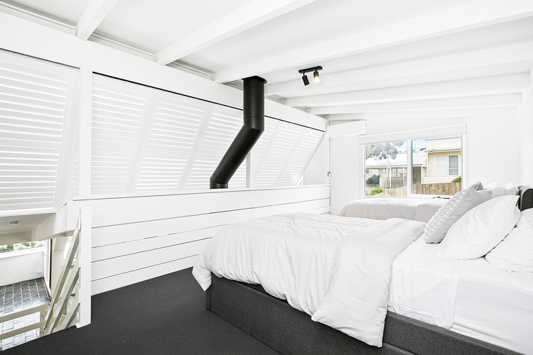 Bedroom four with 2 king single beds and two trundle beds 