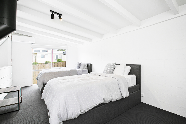 Bedroom four with 2 king single beds and two trundle beds 