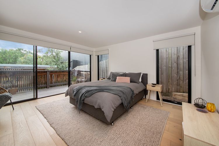 Bedroom with queen bed, air con and balcony access