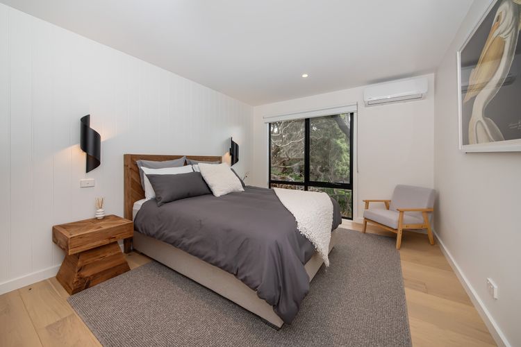 Bedroom two with queen bed and air con 