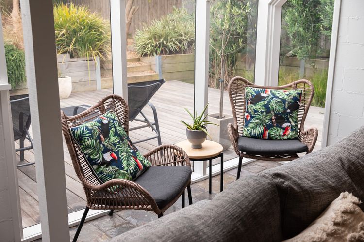 Enjoy each armchair that boasts a sturdy wooden frame, meticulously crafted to ensure durability and stability. 