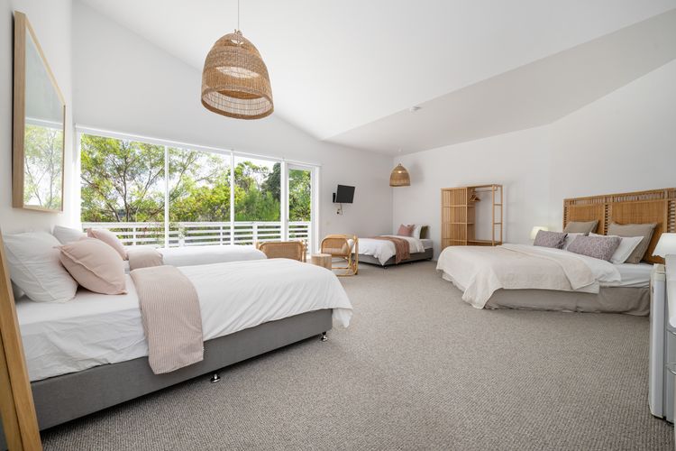 Bedroom six with king bed, two single beds and one king single bed, sleeping 5