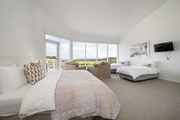 Bedroom four with king bed and two single beds - sleeping four 