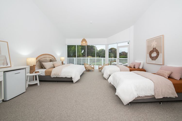 Bedroom two with king bed and two king single beds 