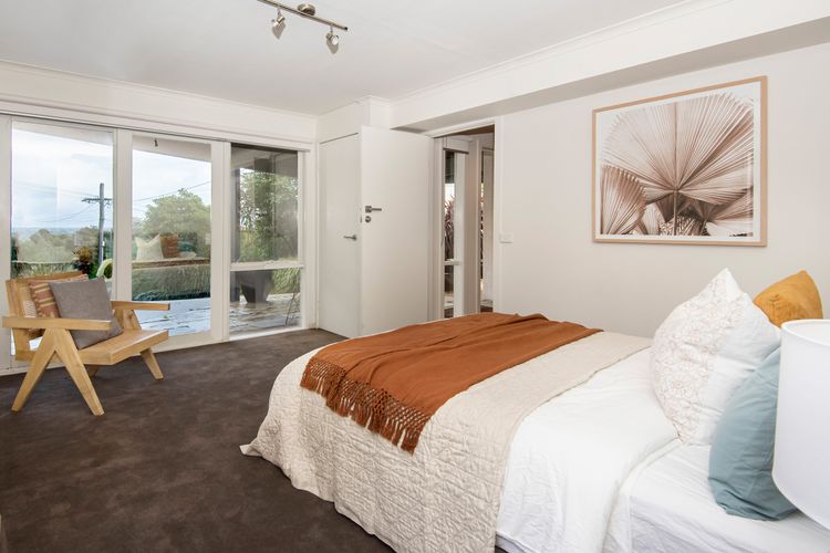 Downstairs bedroom with queen bed