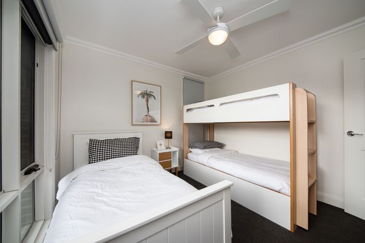 Downstairs bedroom with single bunk and single bed, sleeping 3