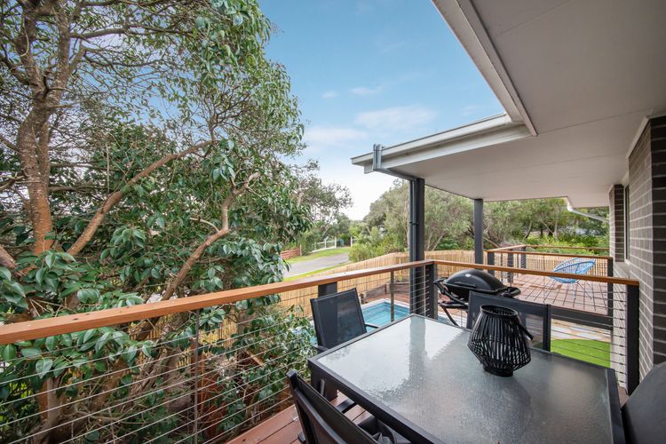 Upstairs balcony overlooking the pool and yard