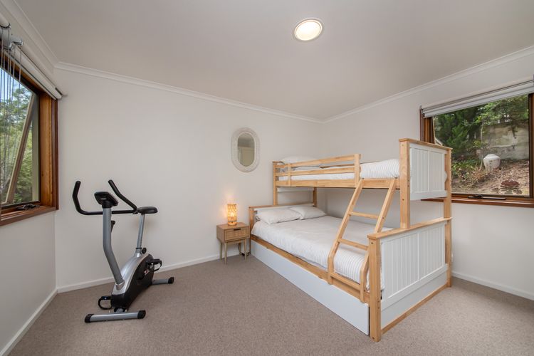 Bedroom two with double bunk and single above 