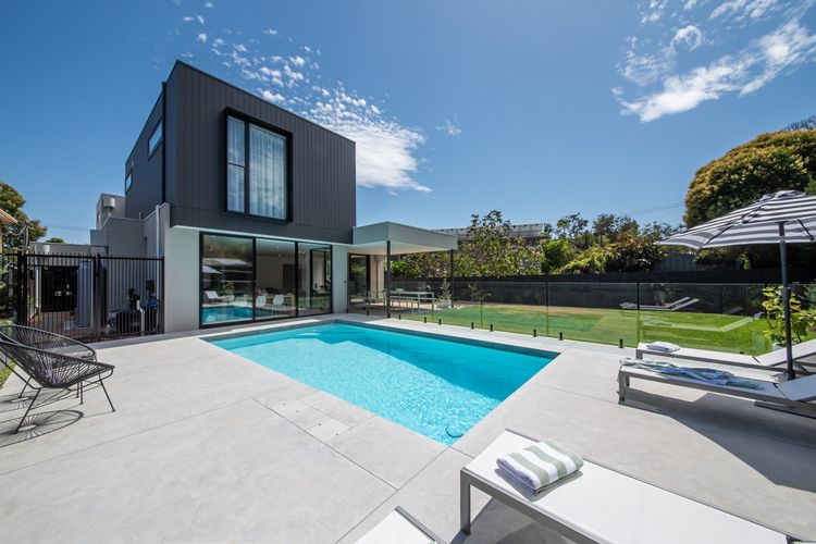 Property facade with solar-heated saltwater pool