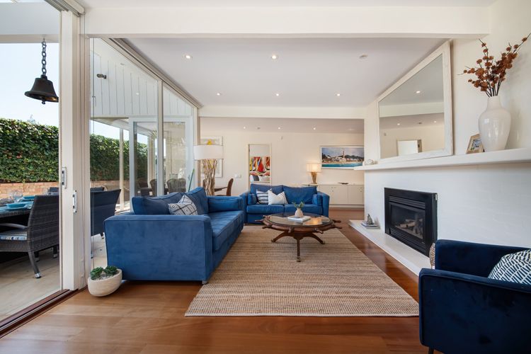 Living room area featuring the fireplace for extra-added cosiness