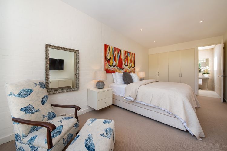 Sophisticated Masters bedroom with King size bed and attached Toilet and Shower