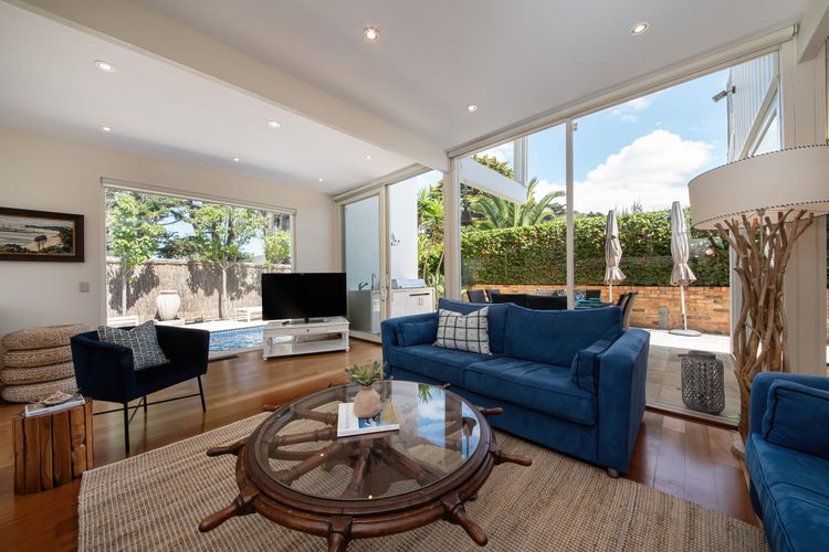 Living room area featuring a nice Smart TV and a view of the pool
