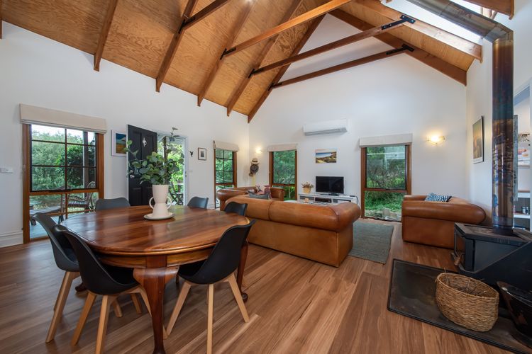 Open plan living and dining with cosy fireplace