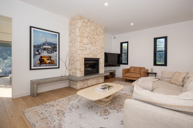 Open plan TV area with fireplace 