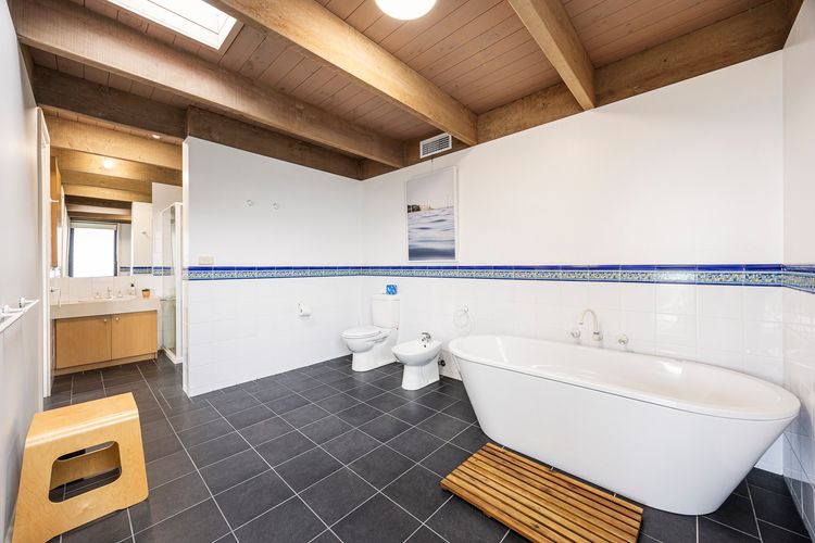 Full bathroom with a tub