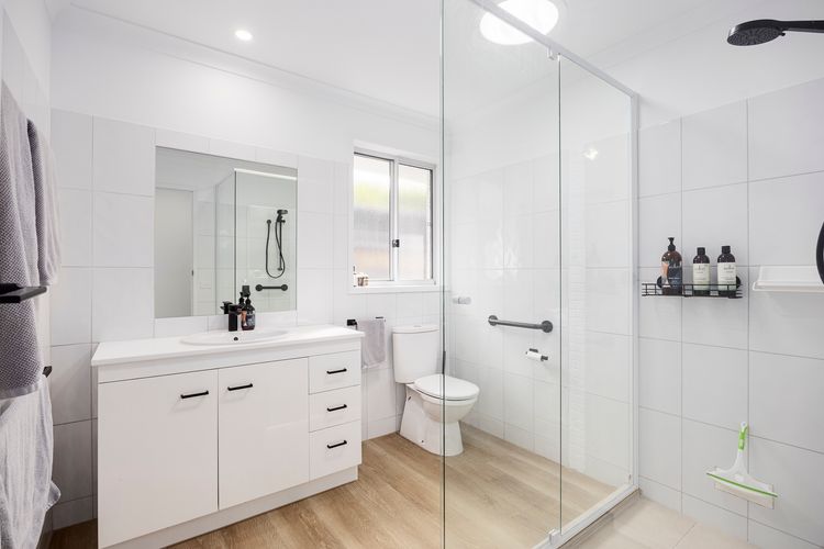 Bathroom with shower starter supplies of shampoo, bodywash & conditioner 