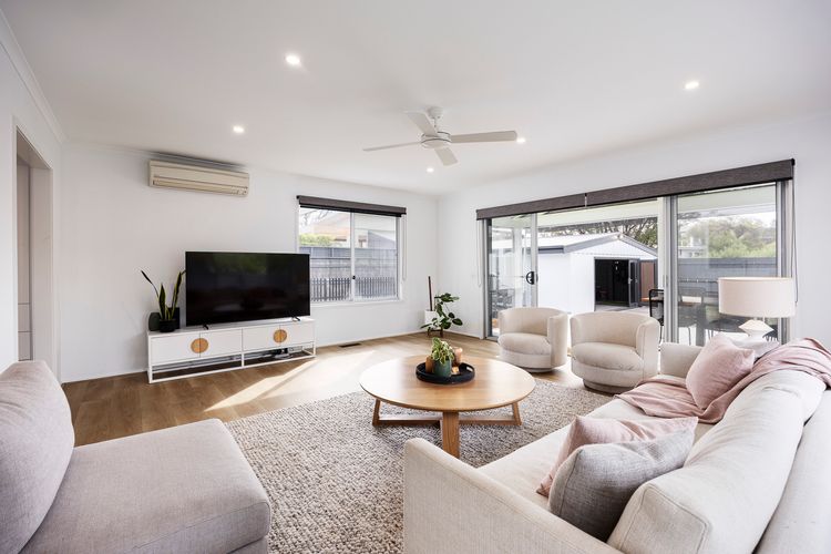 Living room with smart TV and split type AC 