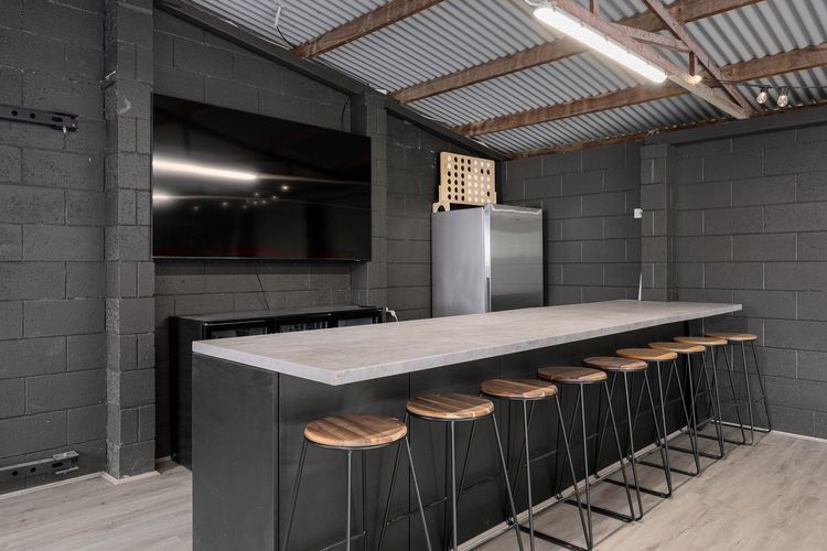 Smart TV and fridge in the hockey table area as well