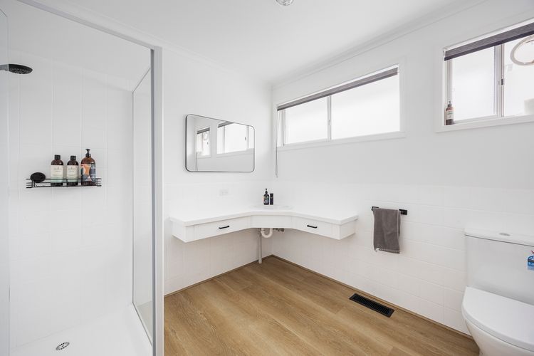 Full bathroom with shower and toilet 