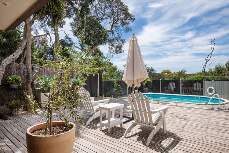 Sun deck next to alfresco dining with TV