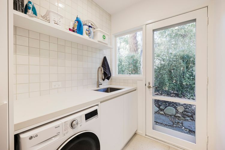 Laundry area with combination washer and dryer 