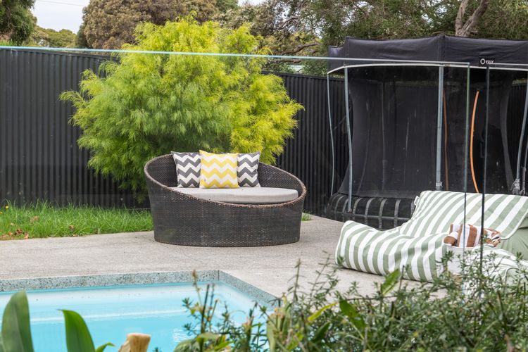 Sun loungers and seating area beside the pool 