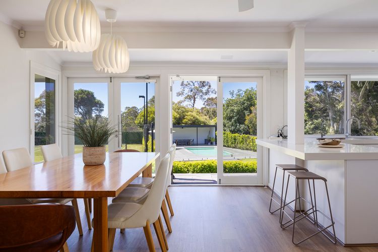 Kitchen and dining looking over the pool and tennis court