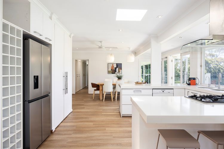 Kitchen with basic appliances and a fridge