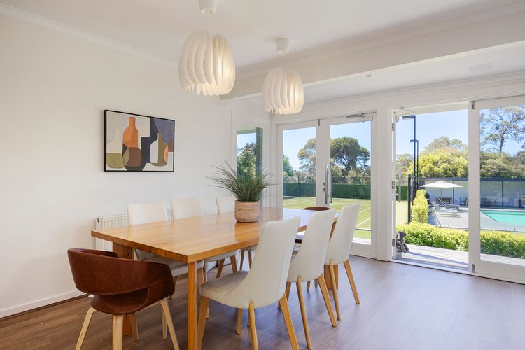 Dining area with the pool and garden view