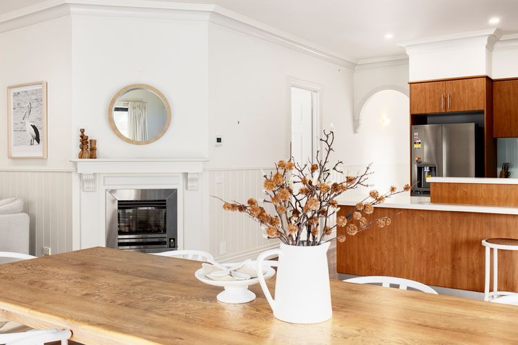 Fireplace near kitchen, dining, and living area 
