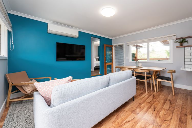 Lounge area with split system AC and Smart TV