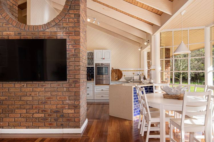 Our wooden dining table and kitchen exude warmth, character, and timeless charm, creating a welcoming atmosphere for gatherings, meals, and culinary adventures.