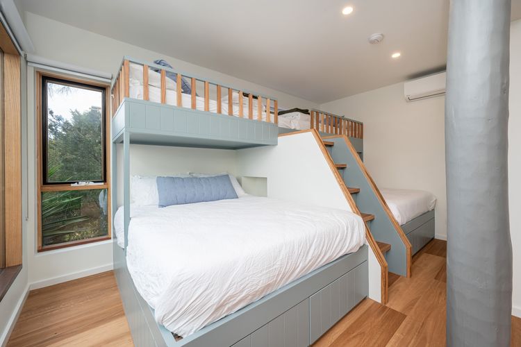 Bedroom four with external access with two queen bunks with king single above. Sleeping 6. with ensuite and air conditioning and access to the heated spa 