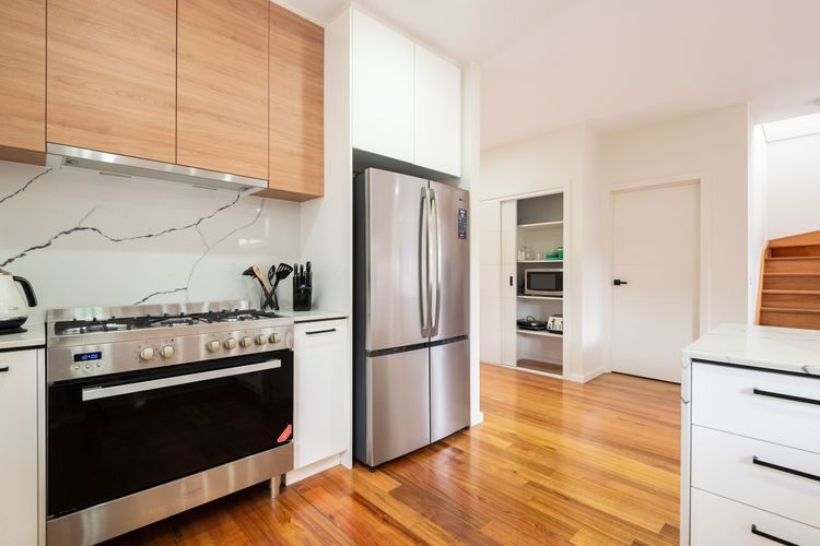 Sleek kitchen with modern, stainless steel appliances